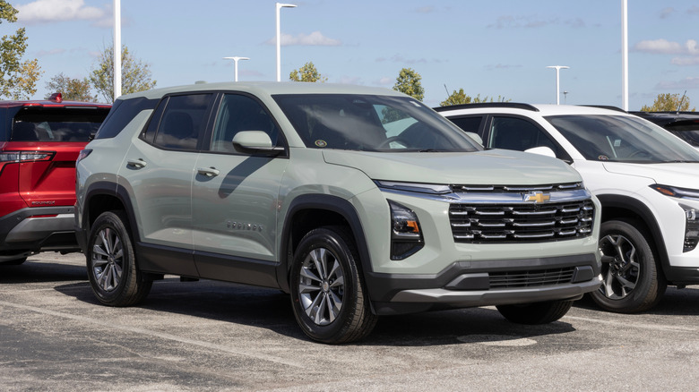 A matte grey Chevrolet Equinox at a dealership.