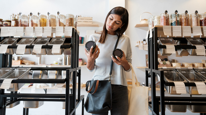 A woman comparing prices