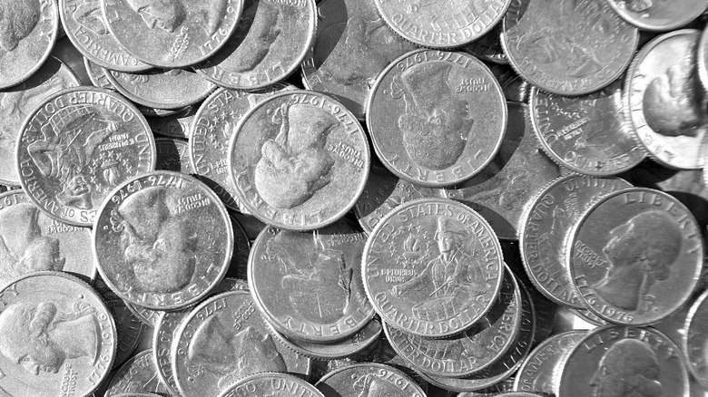 Dozens of quarter coins from the year 1976