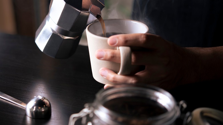 barista making a coffee