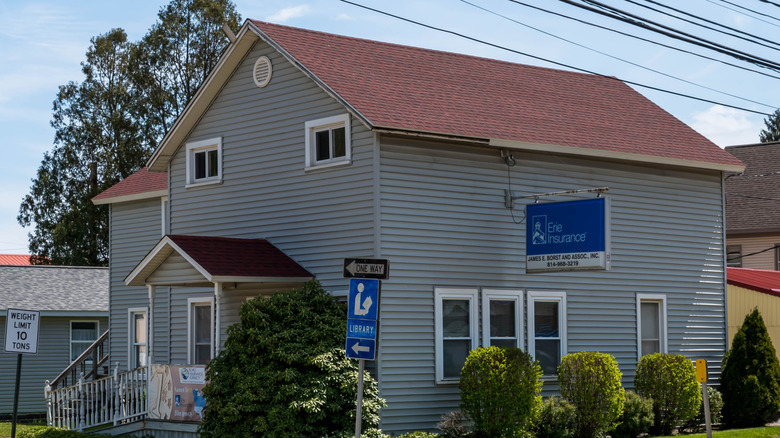An Erie Insurance office building with a sign in a former home in Pennsylvania.