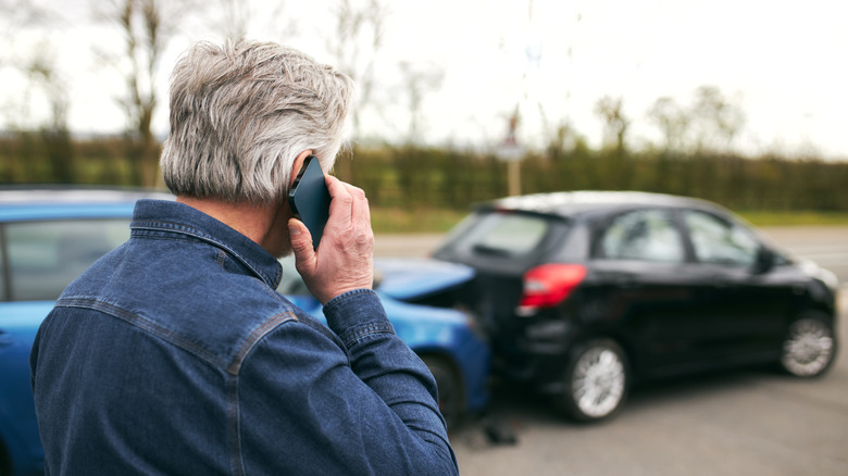 Older man calling for help after a car accident