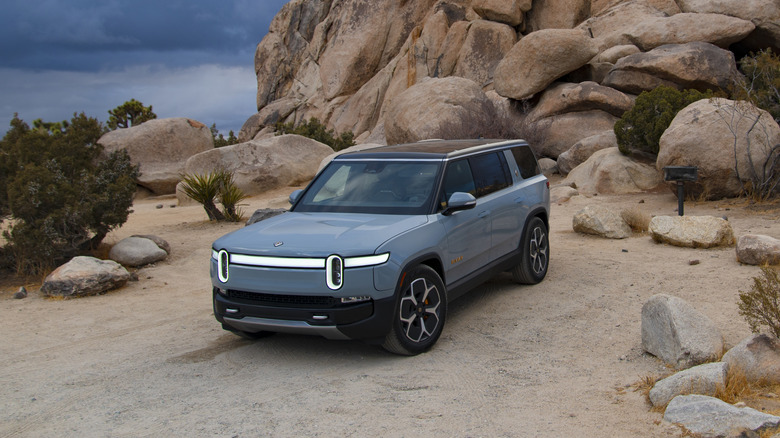 Rivian R1S parked at a rocky campground