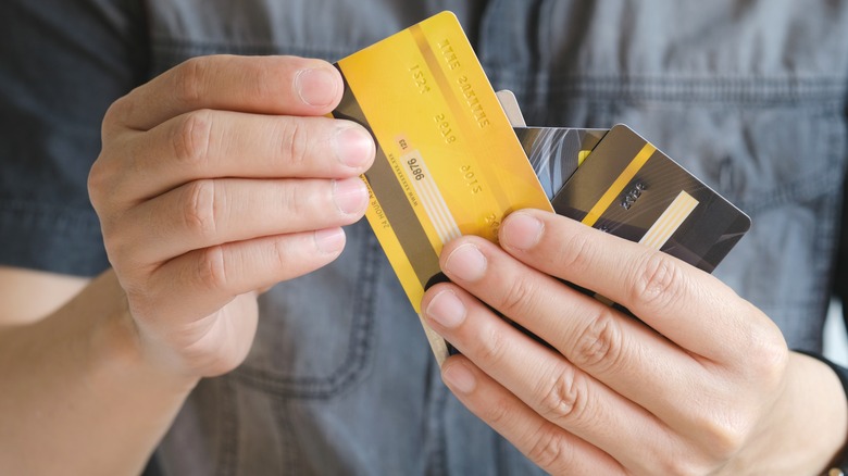 Man holding credit cards
