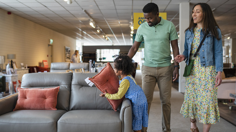 Family looking at couches