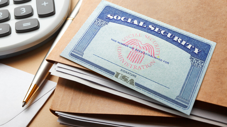social security card on a stack of folders