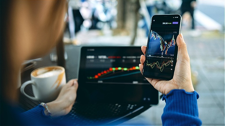 Person checking stocks on phone