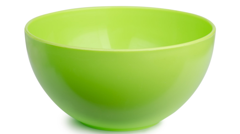 A close up photo of a plastic bowl against a white background