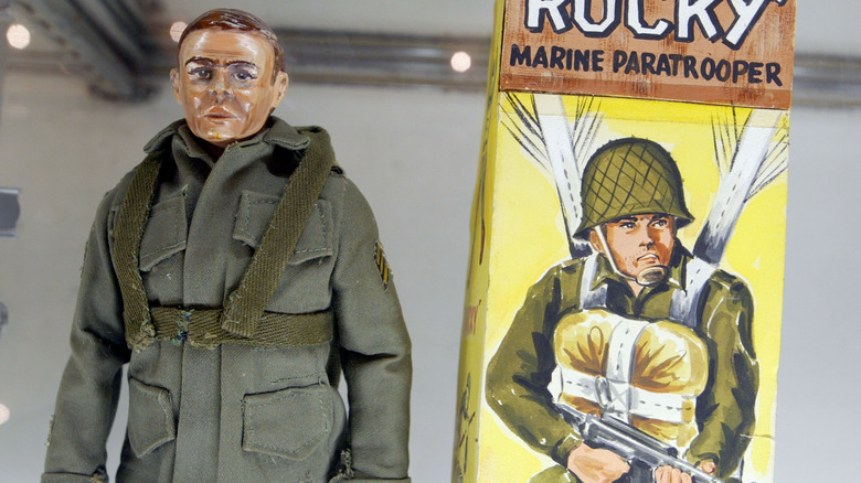 military man action figure in olive drab jacket