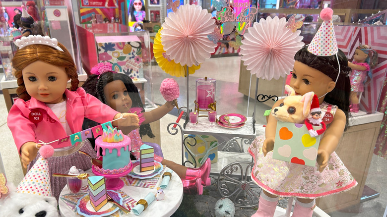 American Girl dolls on display in a store