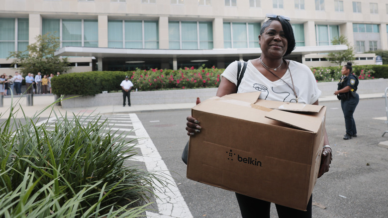One of the many laid-off State Department employees leaving the Harry S. Truman building in July 2025.