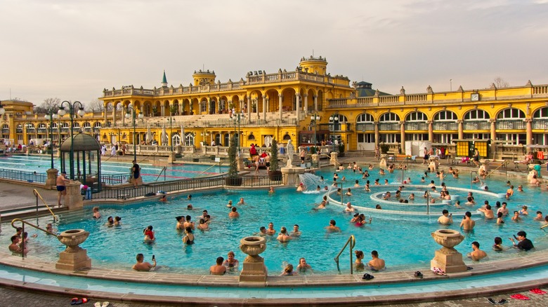 Crowds enjoying the Széchenyi Baths and Pool in Budapest, Hungary.