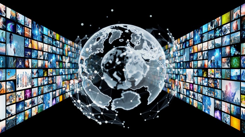 globe and TVs around it