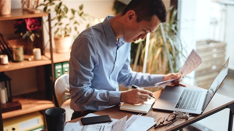 Person managing finances at home