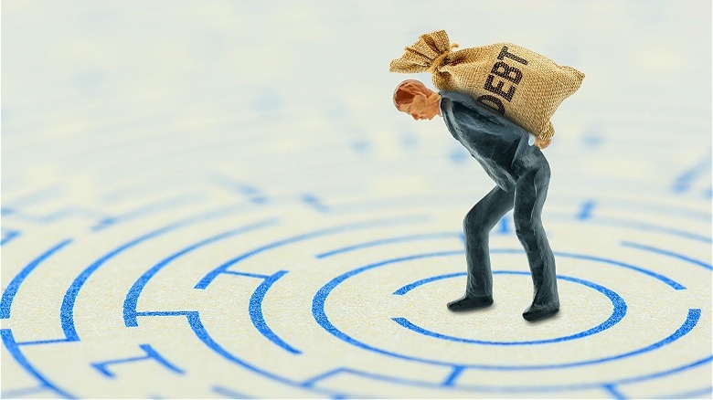 Carrying debt bag in maze