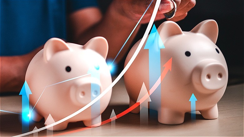 Two piggy banks with arrows