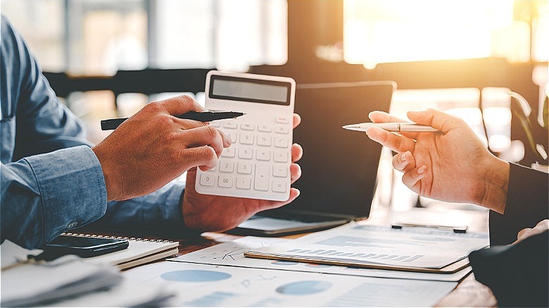 Two people looking over financials