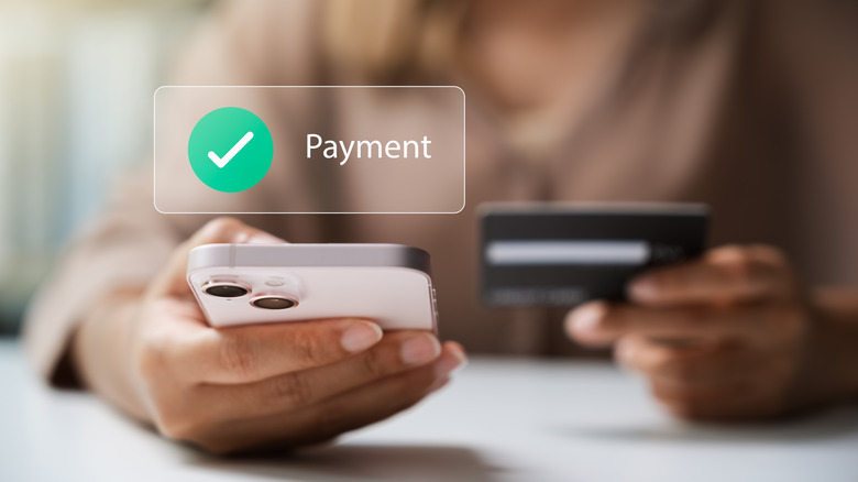 Female customer making a payment with a credit card