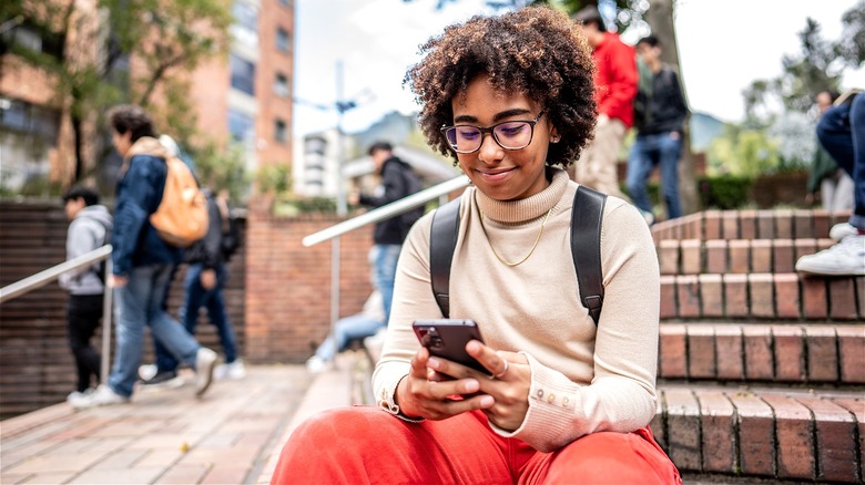 College Gen Zer using phone