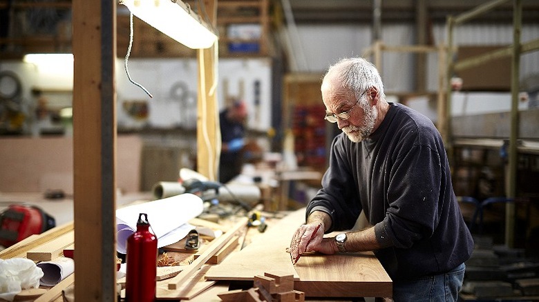Man woodworking in garage