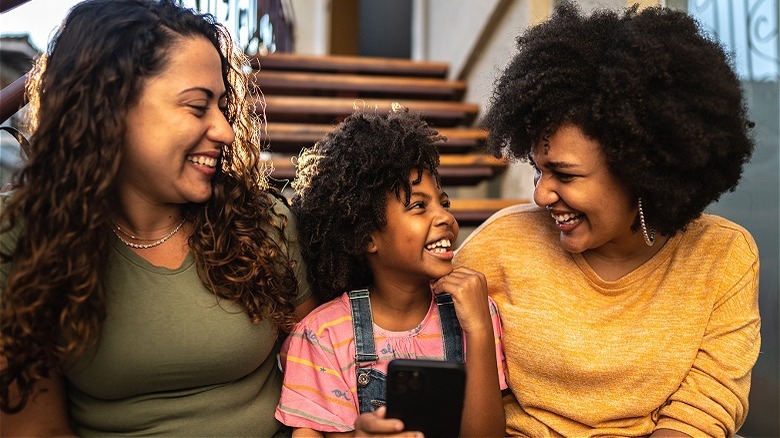 Smiling family on a staircase