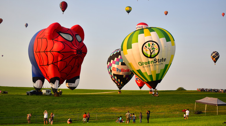 People enjoying the National Balloon Classic Hot Air Balloon Festival in Iowa
