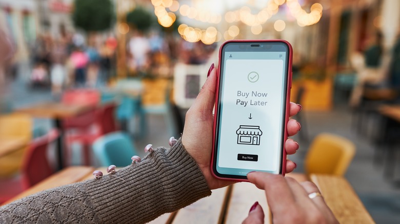 Person shopping online on phone