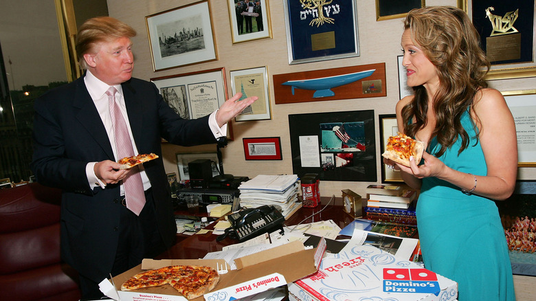 Donald Trump having Domino's Pizza with a contestant of "The Apprentice"