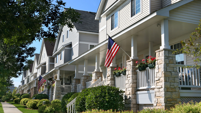 Perfectly manicured row of suburban townhouses on a beautiful summer day.