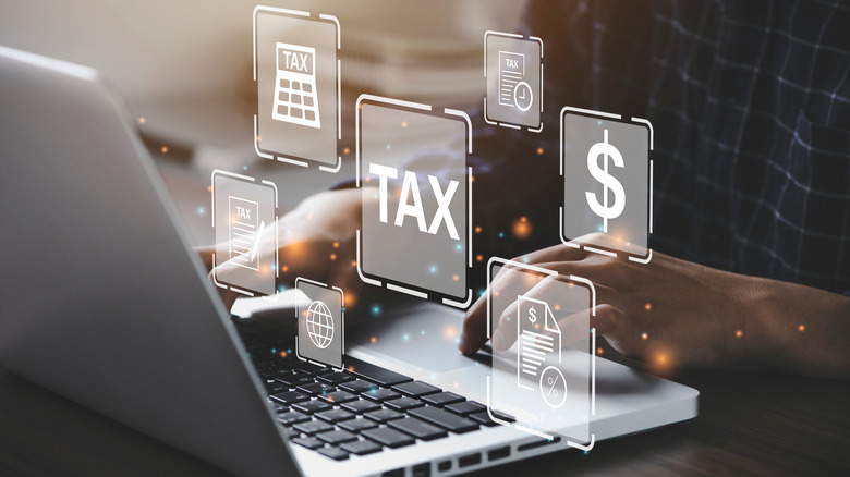 Person at computer paying taxes