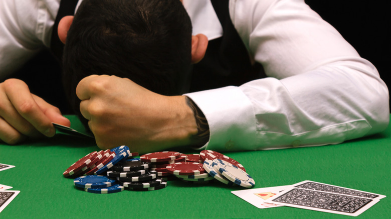 Person losing at poker table