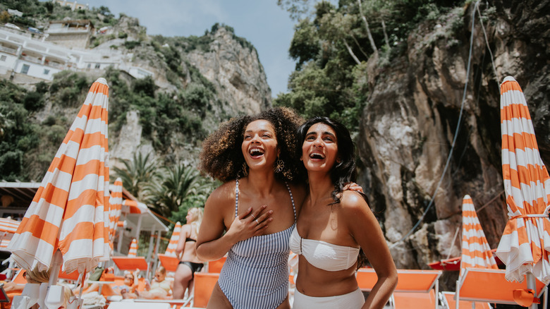 friends at a luxurious pool in Italy