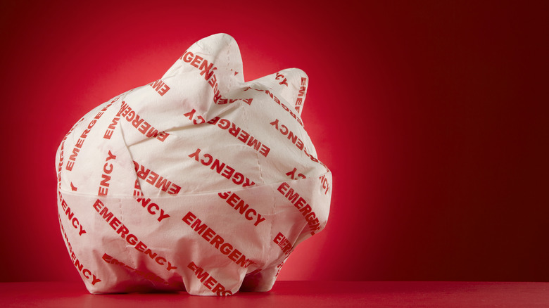 piggy bank with emergency paper