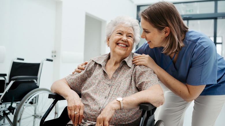 Private nurse talking with an elderly patient