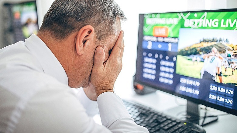 Man looking disappointed from bet
