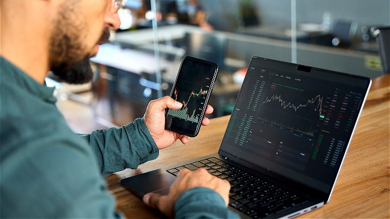 Person reviewing stock market prices