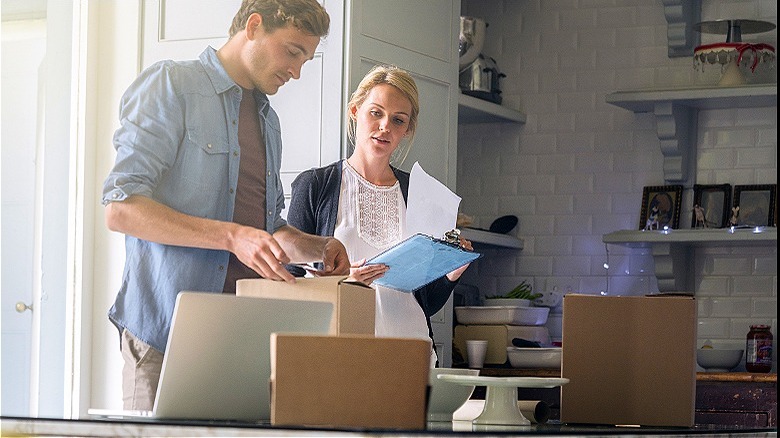 Couple creating home inventory