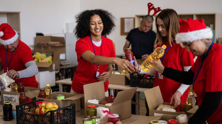 A group of people packing donation boxes