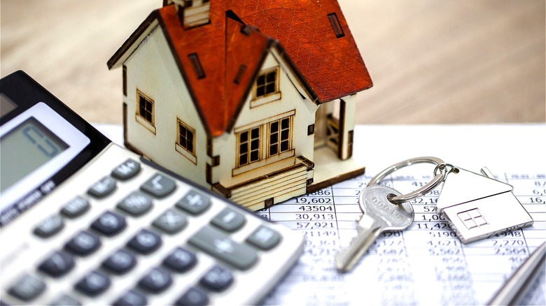 Miniature house with calculator