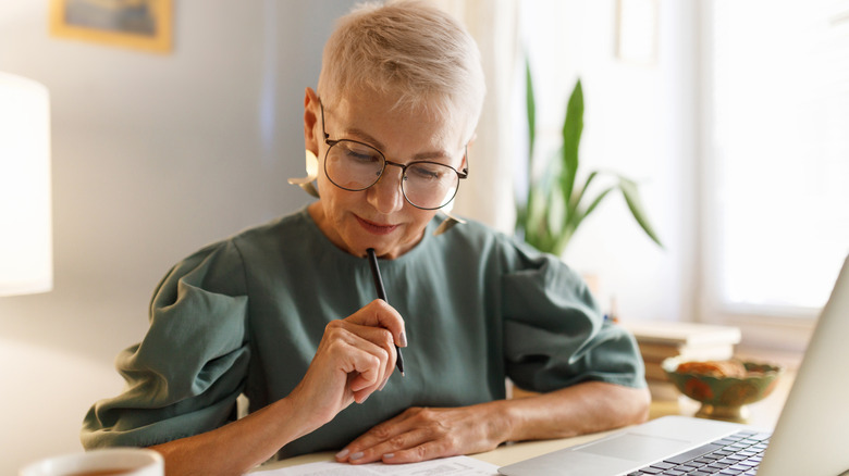 Senior woman working on a laptop.