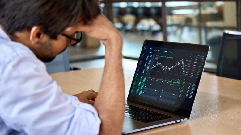 Person watching stock volatility