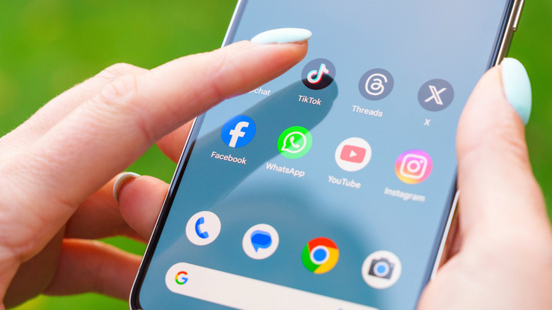 Close-up on the screen of a Google Pixel 8 Pro smartphone, as the user selects an app from the touchscreen.