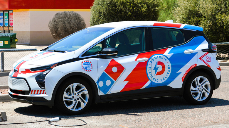 An Dominos pizza delivery electric car
