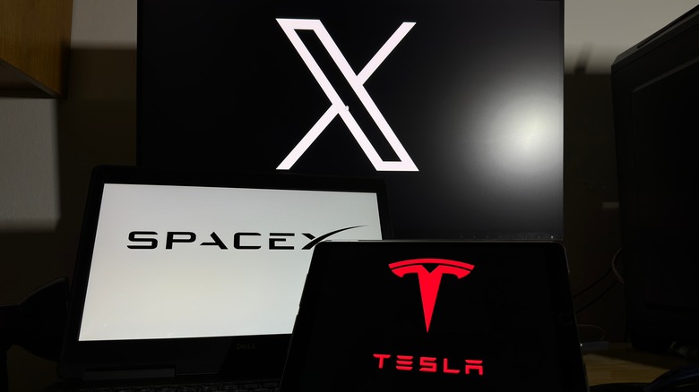 Company logos for X, SpaceX, and Tesla on different screens.