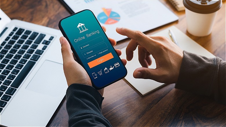 Person mobile banking on smartphone