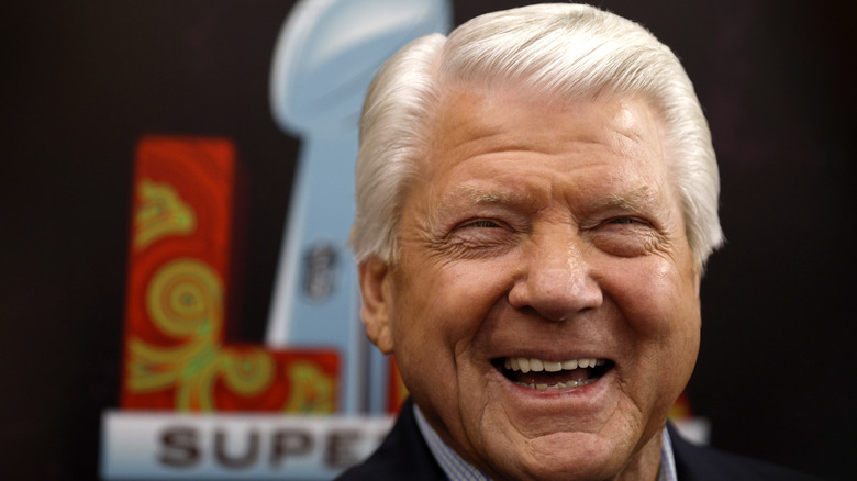 A close-up of NFL coach Jimmy Johnson laughing.