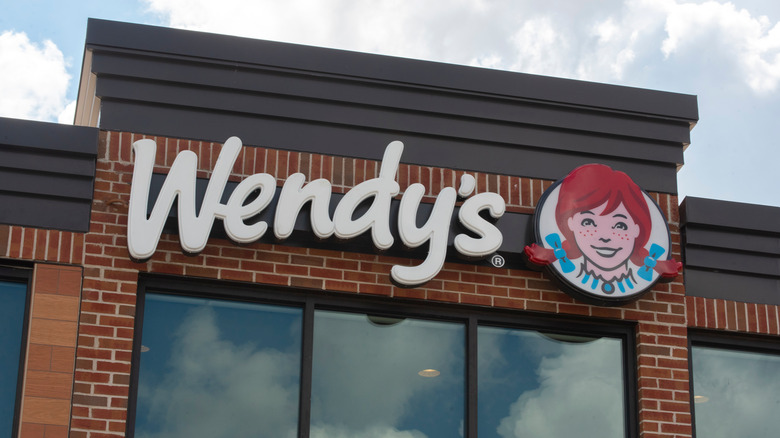 A Wendy's restaurant with brick and sign