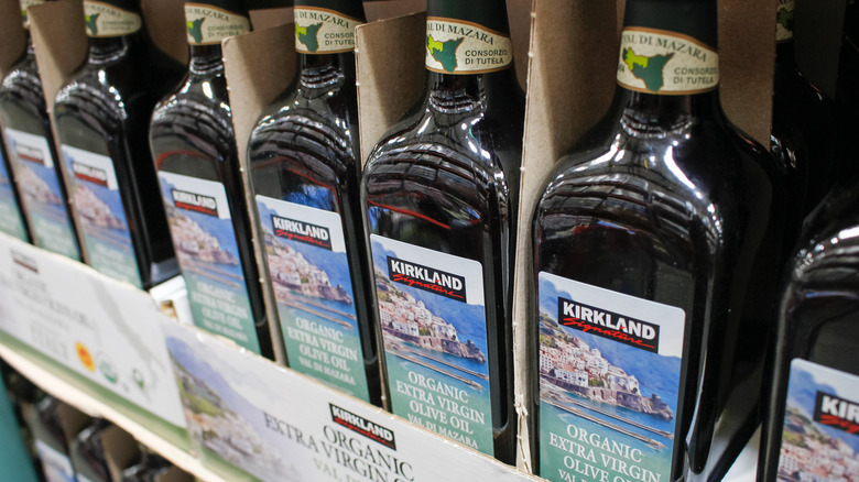 A row of Kirkland Signature Organic Extra Virgin Olive Oil bottles