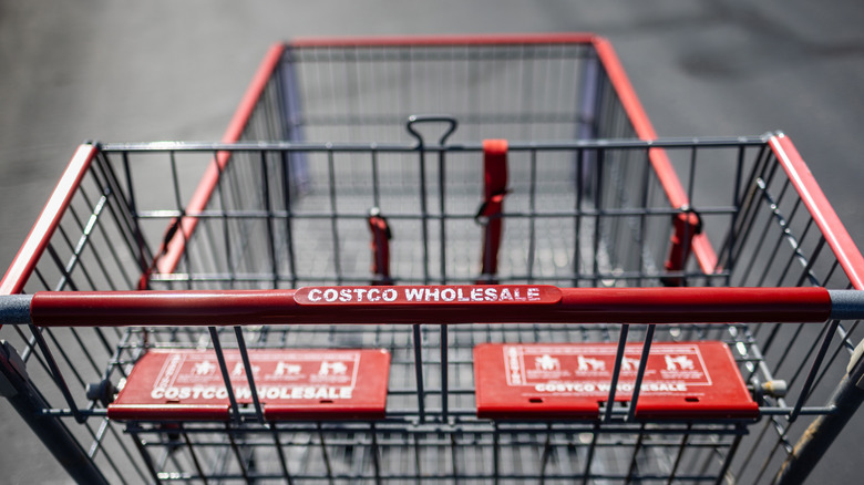 A worn Costco Warehouse shopping cart
