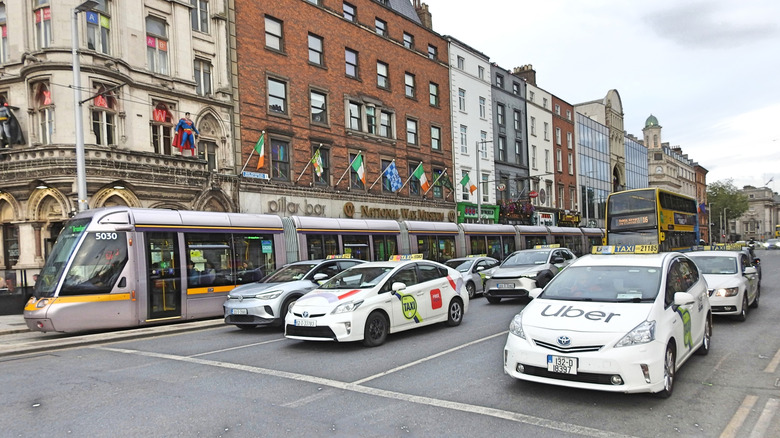 Uber taxis lined up on the road in Dublin, Ireland